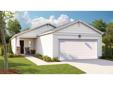 Charming one-story home featuring white siding, an attached garage, and a welcoming front porch at 308 Tiliwa Street, Summerville, SC 29486