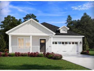 Charming single-story home with a covered porch and a two-car garage provides an inviting curb appeal at 327 Calm Water Way, Summerville, SC 29486
