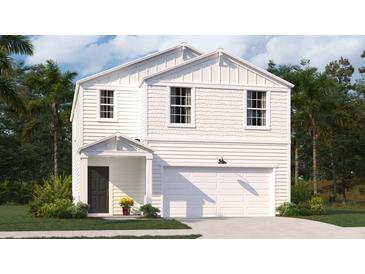 Charming two-story home featuring a covered porch, a two car garage, and crisp, white siding at 606 Quiet Valley Road, Summerville, SC 29486