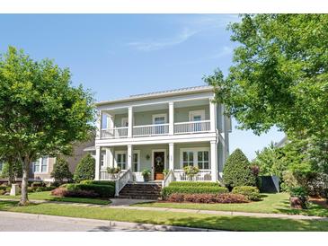 Charming two-story home featuring double porches, manicured landscaping, and a welcoming entrance at 1527 Wando View St, Charleston, SC 29492