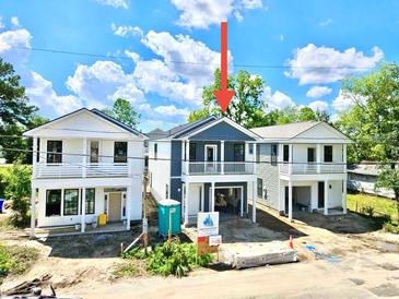 New construction home showing the exterior elevation, with porches on the second story and undercarriage parking at 2033 Echo Ave, North Charleston, SC 29405