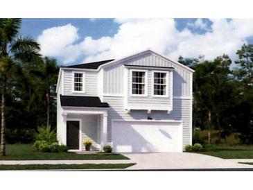 Charming two-story home with a well-maintained lawn, integrated garage and classic architectural details at 328 Tiliwa St, Summerville, SC 29486