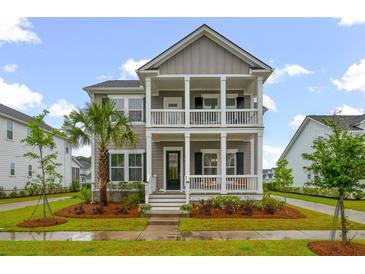 Charming two-story home featuring a double porch, well-maintained landscaping, and inviting curb appeal at 4129 Maidstone Dr, Mount Pleasant, SC 29466