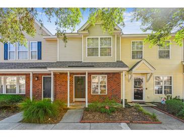 Inviting townhouse with charming brick facade and manicured landscaping at 525 Tayrn Dr, Wando, SC 29492