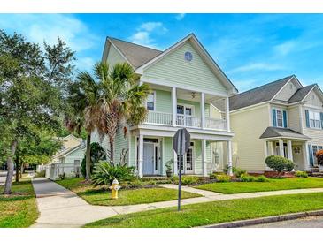 Charming two-story home with a spacious porch and landscaped front yard at 122 Foxglove Ave, Summerville, SC 29483