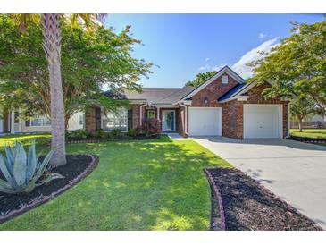 Charming brick home with a well-manicured lawn, mature trees, and a two-car garage at 486 Maple Oak Ln, Charleston, SC 29414