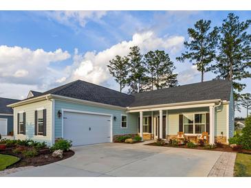 Charming home with a two-car garage, manicured landscaping, and stone-accented porch at 504 Marsh Cove Cir, Summerville, SC 29486