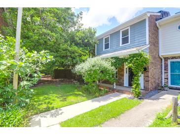 Charming two-story townhome with inviting front yard and walkway at 680 Buckhall Ct, Mount Pleasant, SC 29464