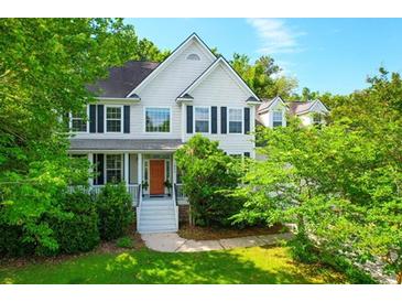 Charming two-story home featuring a welcoming front porch and well-maintained landscaping at 200 Oak Point Landing Dr, Mount Pleasant, SC 29464
