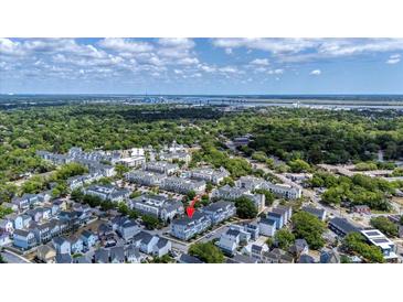 An aerial view of lovely townhomes surrounded by lush green trees and landscaping at 4404 Avery Ave, North Charleston, SC 29405