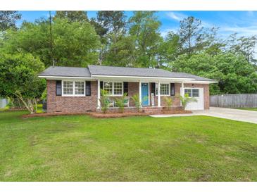 Charming brick home with a well-manicured lawn and a welcoming light blue front door at 105 Bermuda Ct, Summerville, SC 29485