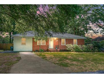 Charming brick and siding home with a well-maintained lawn and mature trees, creating a welcoming curb appeal at 113 Owens Cir, Summerville, SC 29483
