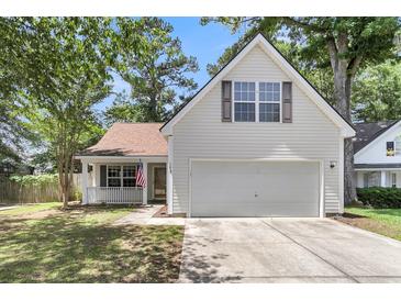 Charming home featuring a classic design, well-maintained lawn, and a two-car garage, perfect for a growing Gathering at 172 Ashton Dr, Goose Creek, SC 29445