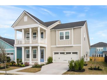 Charming two-story home with a welcoming front porch, manicured landscaping, and an attached two-car garage at 190 Steepbrook Dr, Summerville, SC 29486