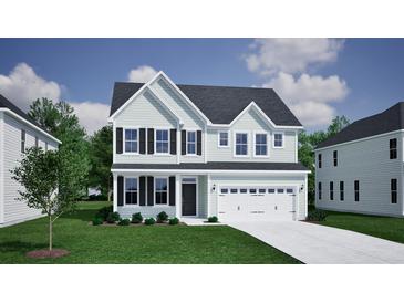 Charming two-story home featuring a covered entryway, attached two-car garage, and manicured lawn at 2476 Grange Cir, Summerville, SC 29486