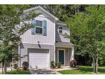 Charming home featuring a one-car garage and neatly maintained lawn at 271 Jackson St, Goose Creek, SC 29445