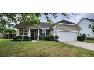 Charming single-story home with a well-manicured lawn and inviting curb appeal at 7019 Lanier St, Hanahan, SC 29410