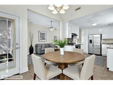 Inviting dining area adjacent to the kitchen features a round table, neutral chairs, and easy access to living spaces at 7869 High Maple Cir, North Charleston, SC 29418