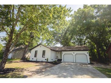 Charming single-story home with a well-manicured lawn, inviting curb appeal, and a two car garage at 10 Bayshore Blvd, Goose Creek, SC 29445