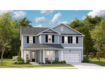 Charming two-story home featuring a symmetrical design, light blue siding and black shutters at 78 French Garden Cir, Summerville, SC 29486