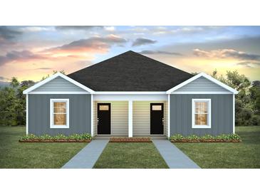 Charming duplex with gray siding, black doors, and a well-manicured lawn at 125 Mims Academy Dr, Harleyville, SC 29448