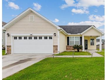 Charming single-story home boasts a well-manicured lawn and inviting curb appeal at 405 Watershed Dr Dr, Goose Creek, SC 29445
