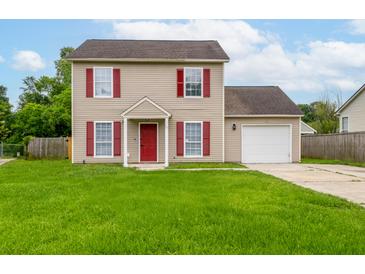 Charming two-story home with red accents, a well-manicured lawn, and an attached one-car garage at 113 Alcester Rd, Goose Creek, SC 29445