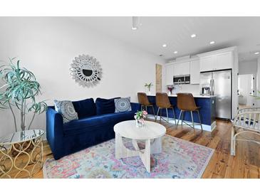 Inviting living room featuring a comfortable blue sofa and stylish decor at 142 President St, Charleston, SC 29403