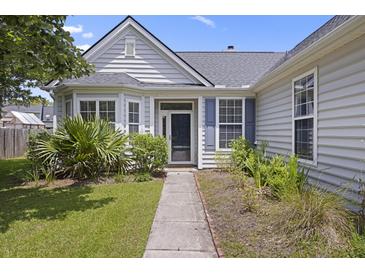 Charming home entrance with well-kept garden, gray siding, and blue shutters at 1470 Ashley Gardens Blvd, Charleston, SC 29414