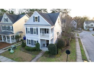 Charming two-story home with a quaint front porch and well-maintained lawn in a friendly neighborhood at 1749 Towne St, Johns Island, SC 29455