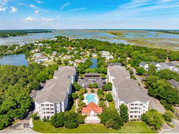 Beautiful aerial view of coastal condo community with pool and marsh views at 1984 Folly Rd # A310, Charleston, SC 29412