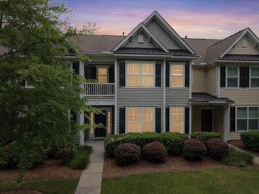 Charming townhome featuring a landscaped front yard, welcoming entrance, and neutral color scheme at 2064 Promenade Ct, Mount Pleasant, SC 29466