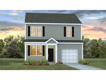 Charming two-story home featuring a well-maintained lawn, a one car garage and a welcoming front entrance at 261 Watersglen Dr, Summerville, SC 29486