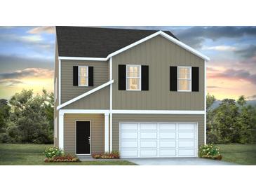 Charming two-story home featuring a two-car garage, black shutters, and manicured landscaping at 301 Watersglen Dr, Summerville, SC 29486