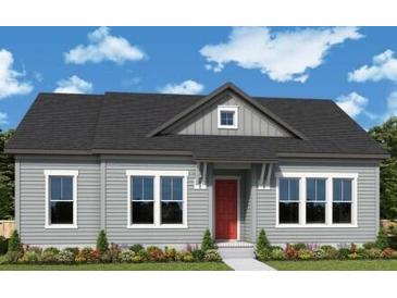 Charming single-story home with light gray siding, black roof, and a well-manicured lawn and shrubbery at 336 Trailmore Ln, Summerville, SC 29486