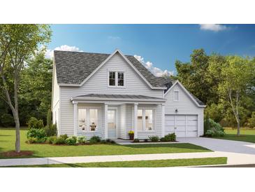 Charming two-story home with white siding, a well-manicured lawn, and an attached two car garage at 84 French Garden Cir, Summerville, SC 29486