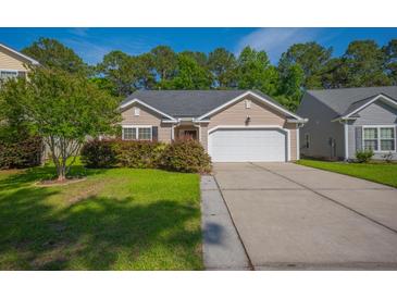 Charming single-Gathering home featuring a manicured lawn and a two-car garage at 261 Sweet Alyssum Dr, Ladson, SC 29456