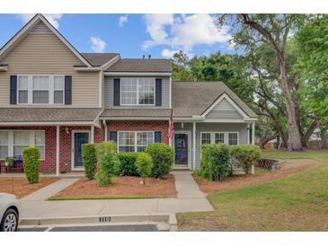Charming two-story townhome with well-maintained landscaping and inviting front entrance at 117 Macy Cir, Goose Creek, SC 29445