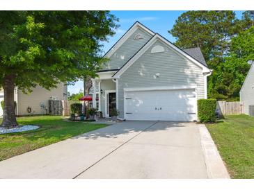 Charming home with a well-manicured lawn, two-car garage, and inviting curb appeal at 3364 Middlesboro Ave, Summerville, SC 29485