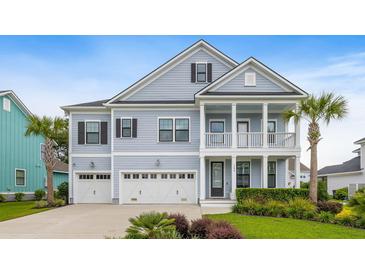Charming two-story home with a double porch, three-car garage, manicured lawn, and mature palm trees at 1234 Captain Rivers Dr, Charleston, SC 29412