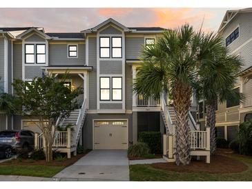 Inviting two-story townhome with well-manicured landscaping and garage at 2087 Sterling Marsh Ln, Seabrook Island, SC 29455