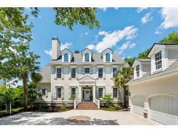 Stately home featuring blue shutters, dormer windows, and a brick walkway to the front door and two-car garage at 3508 Henrietta Hartford Rd, Mount Pleasant, SC 29466