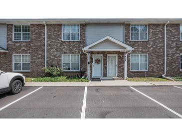 Brick two-story townhouse featuring a well-manicured lawn and convenient parking at 506 Arlington Dr # F, Charleston, SC 29414
