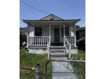 Charming home featuring a classic front porch, enhancing its curb appeal at 1978 Beech Ave, North Charleston, SC 29405