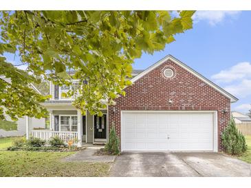 Charming two-story home with brick accents and an attached garage on a sunny day at 4987 Ballantine Dr, Summerville, SC 29485