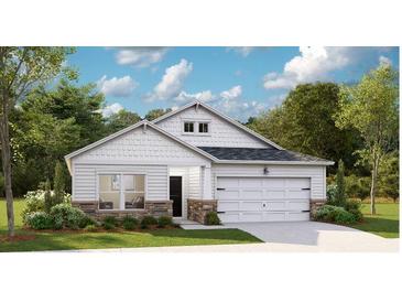 Charming single-Gathering home showcasing stone accents, a two-car garage, and lush landscaping at 1035 Tulip Shell St, Summerville, SC 29485