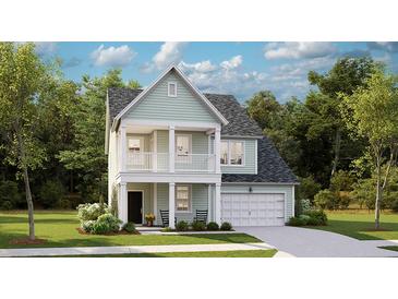 Charming two-story home with a welcoming front porch and a well-manicured lawn at 1043 Tea Time Dr, Summerville, SC 29485