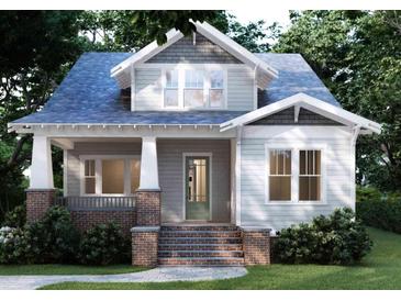 Charming craftsman-style home with inviting front porch and brick accents offers timeless curb appeal at 2101 Wappoo Dr, Charleston, SC 29412