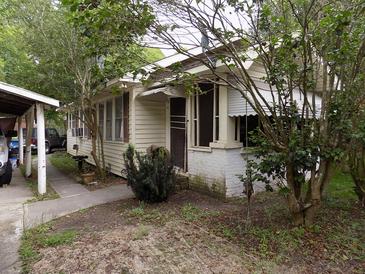 Charming single-story home with mature landscaping and inviting front entrance at 571 Main Rd, Johns Island, SC 29455