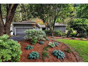 Charming single-story home with well-manicured front yard and mature landscaping at 8 Pony Ln, Charleston, SC 29407